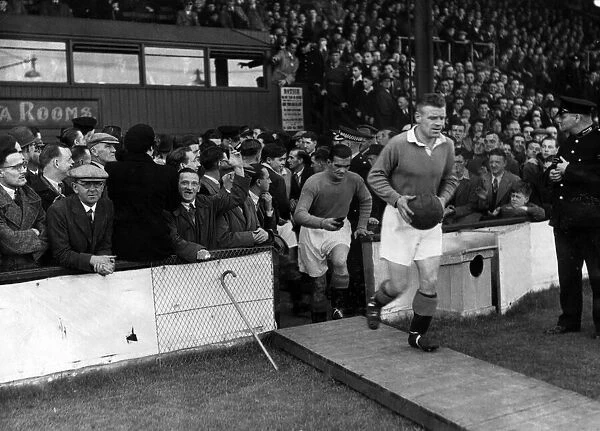 Jock Shaw leads out the Rangers team, followed by Dawson before the Clyde v Rangers