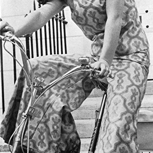 Janet Lyle wearing a silk culotte suit from Annacat