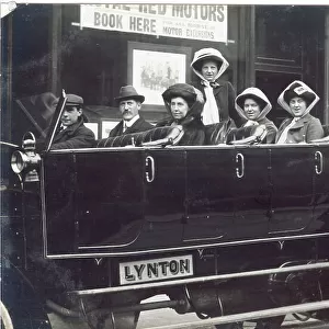 Open air charabanc with smart lady passengers
