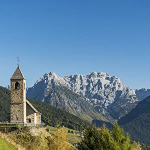 San Leonardo church with the Dolomites in the background, Comelico Superiore, Veneto