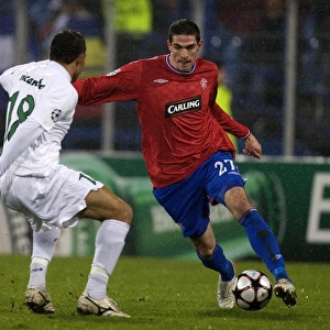 Battle for the Ball: Kyle Lafferty vs Pablo Brandan in Rangers vs Unirea Urziceni, UEFA Champions League Group G (1-1)