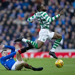 Intense Rivalry: Halliday Tackles Ntcham at Ibrox - Scottish Premiership Clash between Rangers and Celtic (2003 Scottish Cup Winners)