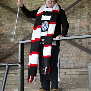 Passionate Ayr United Fan with Scarf and Walking Stick at Somerset Park Before Rangers Scottish Cup Match