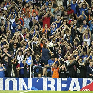 Passionate Rangers Fans Unite: A Sea of Pride and Tradition at Ibrox Stadium During the Europa League Qualifier vs FC Shkupi