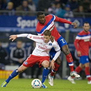 Pivotal Clash: Maurice Edu vs. Marcell Jansen in Hamburg's 2-1 Victory over Rangers