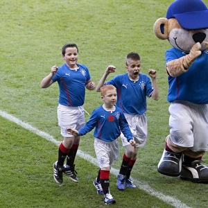 Rangers Football Club: Thrilling Celebration as Mascots and Broxi Bear Reunite at Ibrox Stadium during Rangers vs Airdrieonians Match