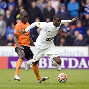 Rangers Maurice Edu Foul by Morgaro Gomis in Intense Clydesdale Bank Scottish Premier League Clash: Rangers 2-1 Dundee United