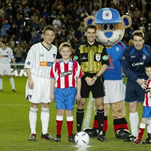 Rangers Triumph: Celebrating a 4-1 Victory over Dunfermline with Their Mascot (23/03/04)