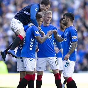 Rangers Triumph: Tavernier and Halliday Celebrate Scottish Premiership Victory at Ibrox Stadium