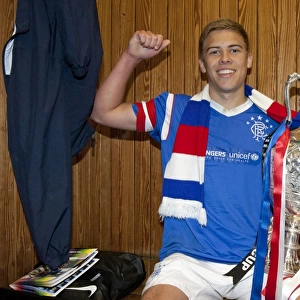 Rangers U17s Triumph: Andy Murdoch's Euphoric Celebration with the Glasgow Cup at Ibrox Stadium (2012)