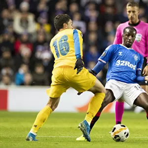 Rangers vs. FC Porto: Glen Kamara Tackles Mateus Uribe in Europa League Clash at Ibrox Stadium (2-0)