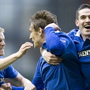 Triumphant Threesome: Jelavic, Naismith, and Lafferty Celebrate Rangers Goals in Clydesdale Bank Scottish Premier League