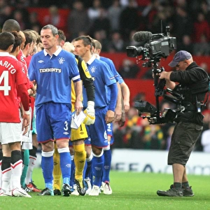 A United Front in UEFA Champions League: David Weir's Historic Handshake at Old Trafford (0-0) - Manchester United vs Rangers