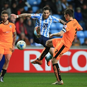 Romain Vincelot vs Owen Garvan: Intense Battle for the Ball in Coventry City vs Colchester United, Sky Bet League One, Ricoh Arena