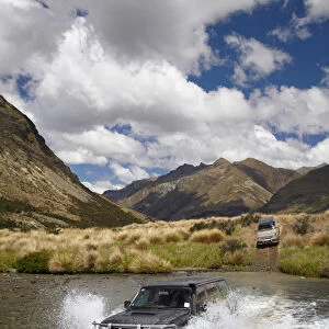 4WD crossing the Mararoa River, near Mavora Lakes, Southland, South Island, New Zealand