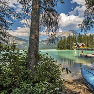 Blue canoe on shore of Emerald lake in Yoho National Park, Canada
