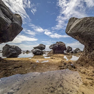 Fiji, Taveuni Island. Rock formations on the beach of Lavena showing erosion