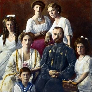 CZAR NICHOLAS II OF RUSSIA (1868-1918). With his family in 1910. Oil over a photograph