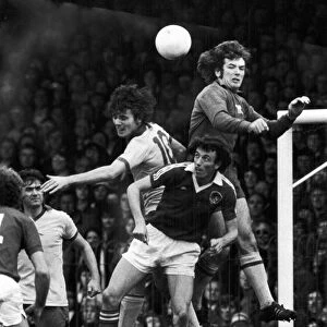 ENGLAND: SOCCER MATCH, 1977. Pat Jennings of Arsenal FC jumps above his own defense player (left) to block a goal by Bristol City, 22 October 1977