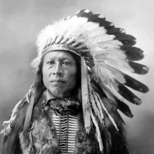 SIOUX BRAVE, c1900. Stampede, a Sioux Native American brave. Photographed by John Alvin Anderson, c1900
