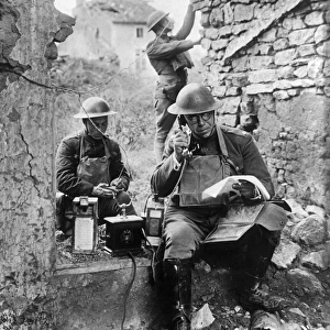 WWI: TELEPHONE, c1917. Communications officers operate a field telephone. Photograph