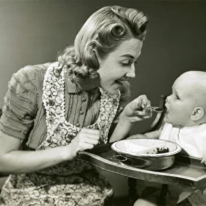 Mother feeding baby