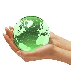 Womans hands holding an Earth globe