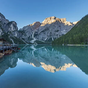 Boathouse with Croda del Becco (Seekofel) reflected in Braies Lake (Lago di Braies) in the Bolzano Province (South Tyrol) Dolomites, Italy