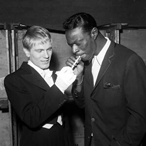 Adam Faith with Nat King Cole taking a break from rehearsing for the Royal Variety