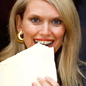 Anneka Rice with 25 pounds of Churnton cheese outside the Howar Hotel where they are