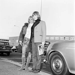 Brian Jones of the Rolling Stones melt his girl friend Anita Pallenberg as she arrived at