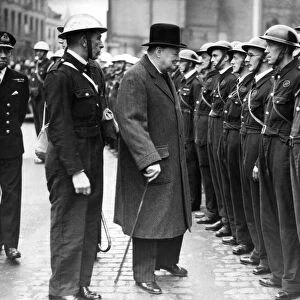 The British Prime Minister, Mr. Winston Churchill, is inspecting members of Coventry