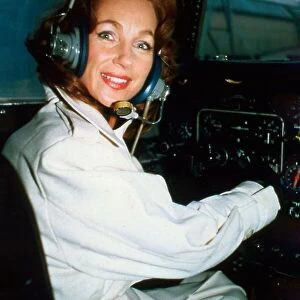 English actress Shirley Anne Field in the cockpit of a helicopter. June 1980