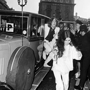 John Lennon and Yoko Ono arrive at the premiere of "Yellow Submarine"film