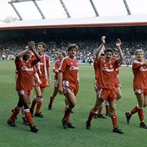 Liverpool players acknowledge their fans and celebrate winning the League Championship at