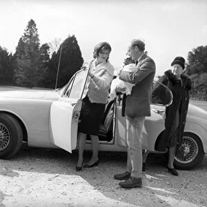 Lord Montagu and his wife, pictured on arrival at the Beaulieu, with the baby Ralph