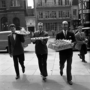 Restaurant men from the Caprice on their way to the Law Courts to serve lunch to