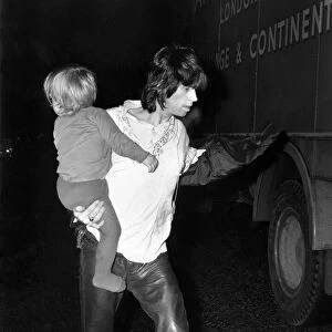 Rolling Stones: Keith Richard backstage with his son Marlon March 1971